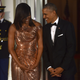 President Barack Obama and first lady Michelle Obama wait for the arrival of Italian Prime Minister Matteo Renzi and his wife, Agnese Landini, on the North Portico of the White House before a state dinner in Washington, D.C., on Oct. 18, 2016.
NICHOLAS KAMM/AFP/Getty Images